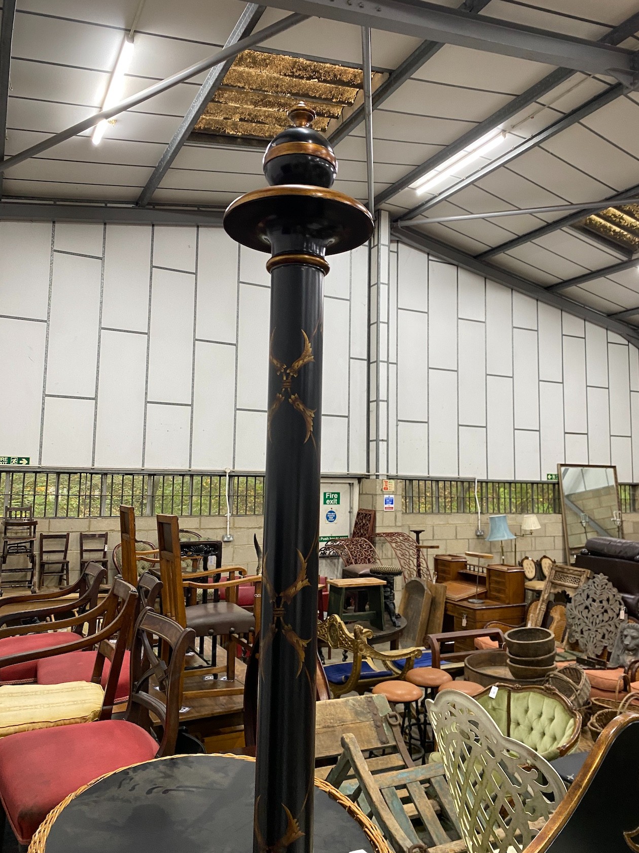 A reproduction black painted four poster bed frame with mirrored headboard, width 170cm, length 210cm, height 250cm